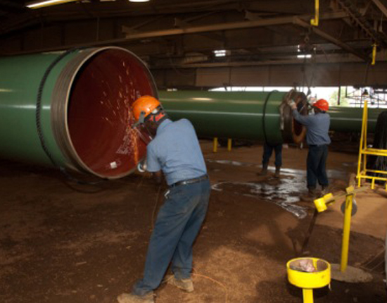 Men repairing pipe lines