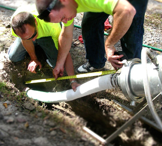 Men replacing a trenchless sewer line